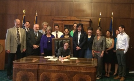 Governor Brown signing the e-cigarette bill into law on May 27