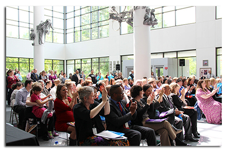 Leadership Academy grads applaud one of their own at May 13 ceremony.